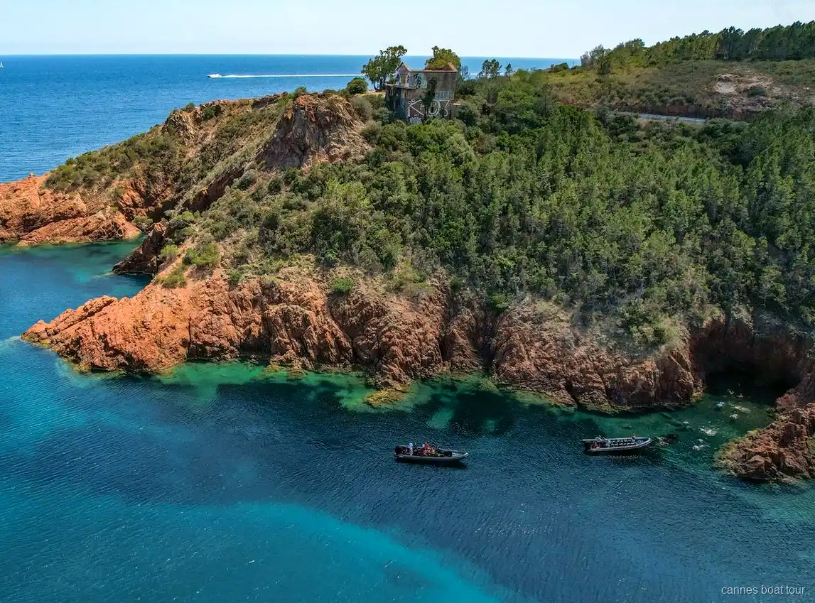 RIB boat along the red cliffs of the Esterel massif near Cannes