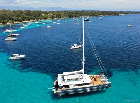 Guests swimming off the catamaran near Fort Royal on the Cannes boat tour